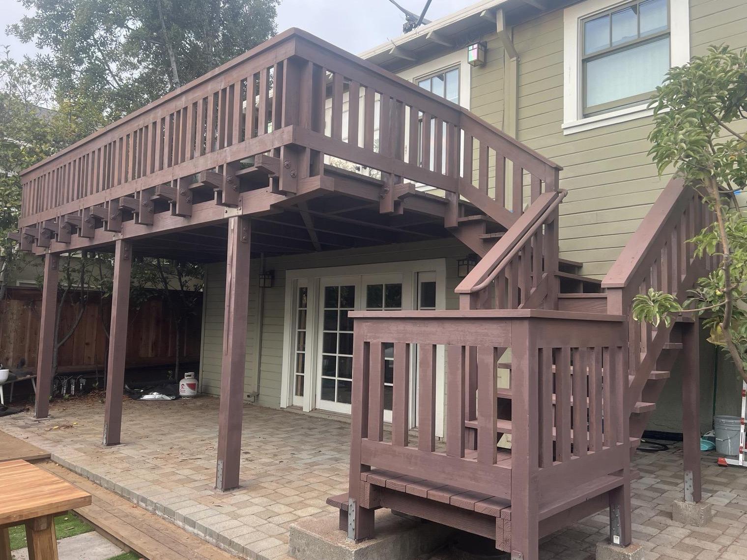 Same staircase refinished with a rich stain