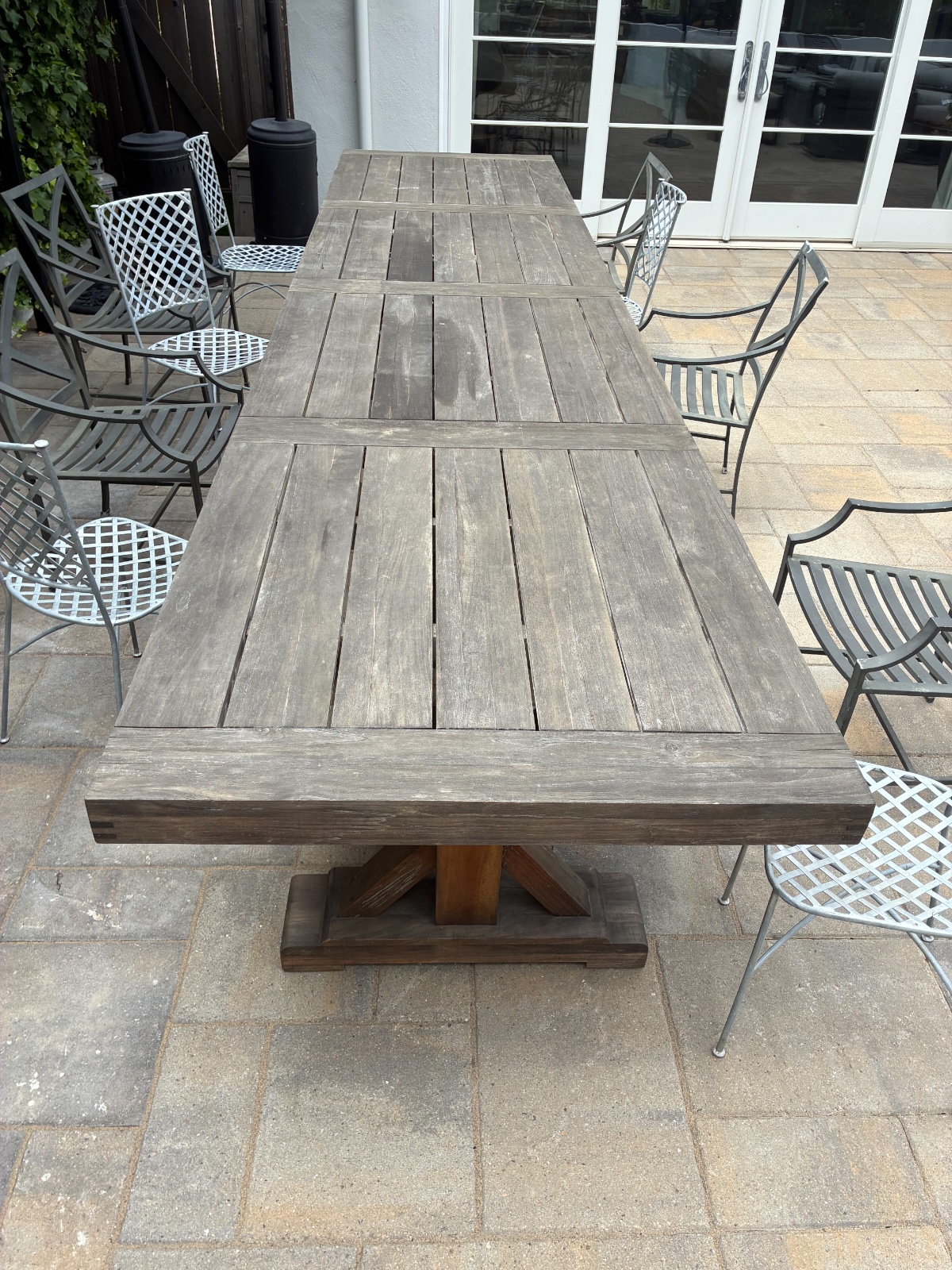 Weathered grey patio table before restoration