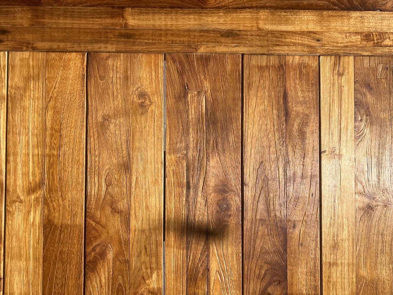 Close-up of restored wood grain showing the finished tone and texture
